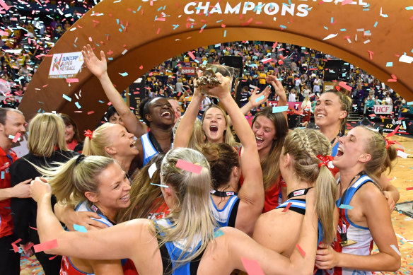 The NSW Swifts celebrate their 2019 grand final win. 