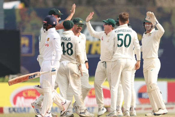 Matthew Kuhnemann of Australia celebrates after taking the wicket of Dhananjaya de Silva 