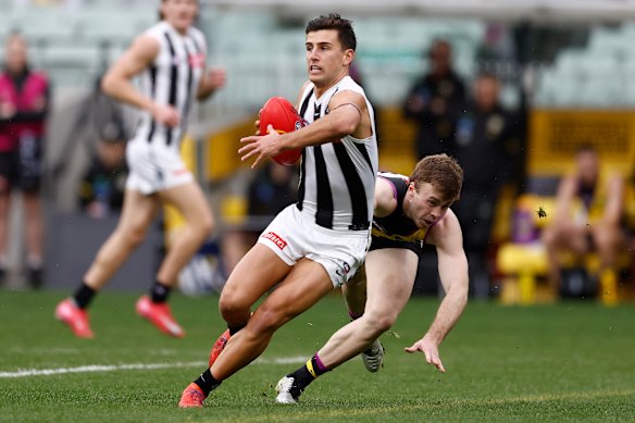 Nick Daicos shows his opponent a clean pair of heels.