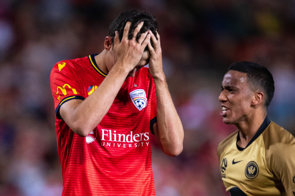 Adelaide United's George Blackwood after missing the injury-time penalty that handed the Wanderers victory.