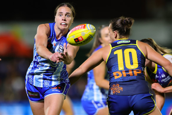 Jasmine Garner gets a handball away against Adelaide’s Ebony Marinoff in October.