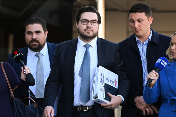 Bruce Lehrmann (centre) and his lawyer Rowan King (left) leave Toowoomba Magistrates Court after his committal hearing.