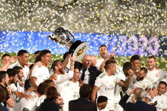 Captain Sergio Ramos lifts the cup as Real Madrid celebrate taking the La Liga title.