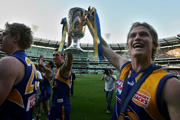 Adam Selwood (right) with the AFl Premiership Cup following West Coast’s 2006 win. 