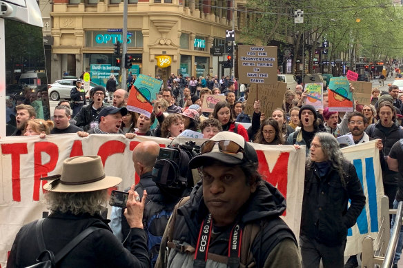 XR activists marched down Collins Street on Friday morning.