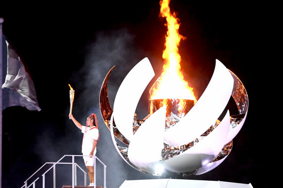 Tennis player Naomi Osaka lights the Olympic cauldron to kick off the Tokyo Games.