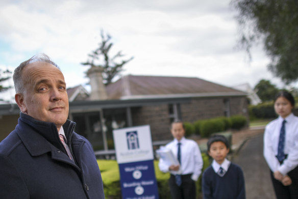 Mark Dooley, head of school at Avalon College with students  Angel, Mick and Julia.