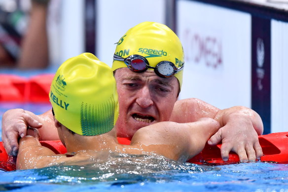 Grant Patterson left, and Ahmed Kelly, both of Australia, embrace after finishing third and second respectively in the Men’s SM3 150 metre Individual medley final at the Tokyo Aquatic Centre.