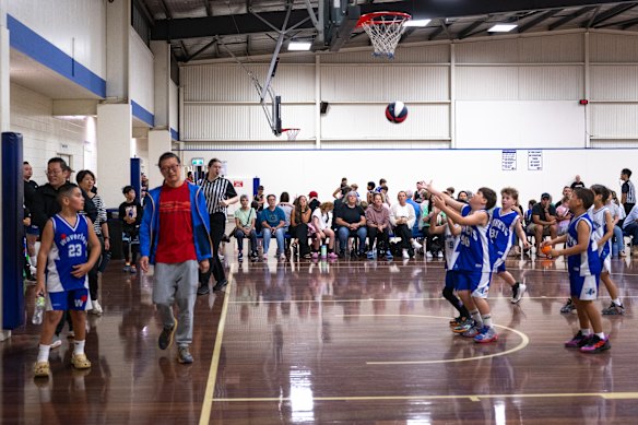 Parents and children cram into courts three and four at Nunawading Stadium for Saturday basketball.