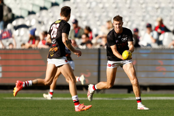 Josh Battle (left) and Dougal Howard of the Saints warm up.