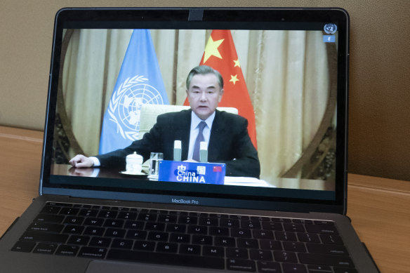 Chinese Foreign Minister Wang Yi, seen on a computer monitor delivering a remote address to the UN.