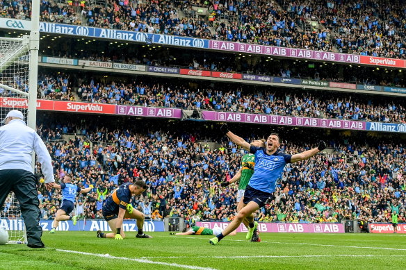 Colm Basquel of Dublin celebrates after teammate Paddy Small, 10, scored their side’s o<em></em>nly goal during the GAA Football All-Ireland Senior Champio<em></em>nship final match between Dublin and Kerry at Croke Park in Dublin.