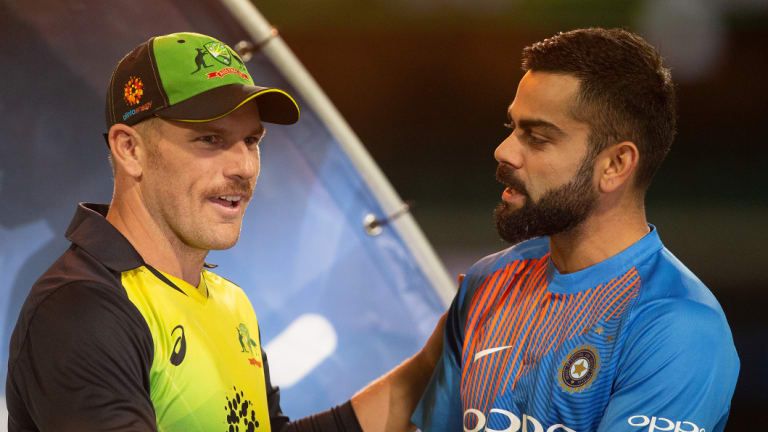 Aussie skipper Aaron Finch chats with Kohli after the latter's impressive performance at the SCG.