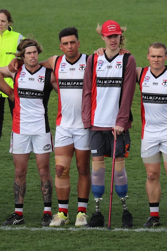 Inspirational: Josh "Chooka" Hanlon with teammates during the anthem.