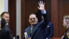 Johnny Depp gestures to the gallery in the courtroom as he leaves for a break.