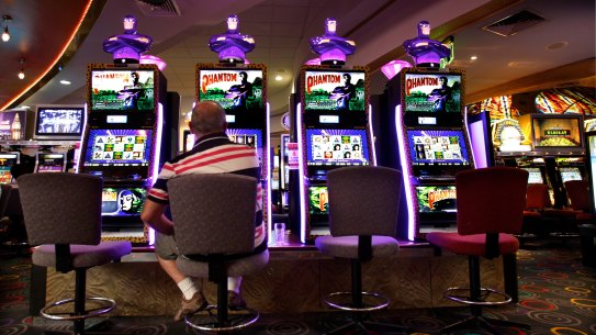 A patron playing the poker machines at rugby league club in Sydney.