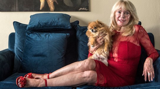 "We're all going to miss our treatments": Christa Billich at home with her dog, Charlie.