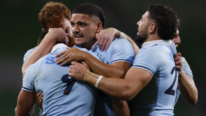 Waratahs players celebrate their win against the Crusaders in Melbourne