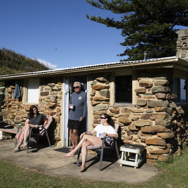 Ken Holloway with his daughters Georgia and Sophie at their shack at Era.