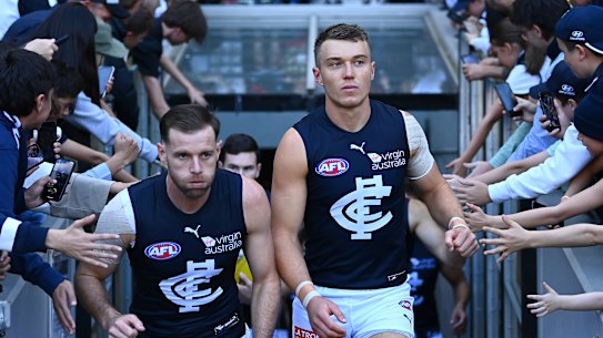 MELBOURNE, AUSTRALIA - MAY 02: Sam Docherty and Patrick Cripps of the Blues lead their team out onto the field during the round seven AFL match between the Essendon Bombers and the Carlton Blues at Melbourne Cricket Ground on May 02, 2021 in Melbourne, Australia. (Photo by Quinn Rooney/Getty Images)