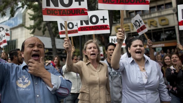 Venezuelans take to streets in walkout to push Maduro out
