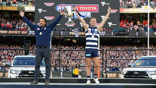 Joel Selwood and Chris Scott celebrate the Cts’ premiership win.