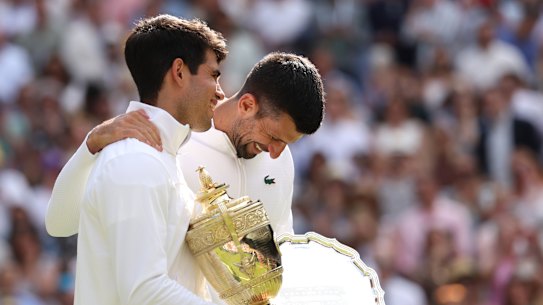 Carlos Alcaraz with the spoils of his Wimbledon victory over Novak Djokovic last year.