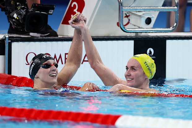 USA swimmer Katie Ledecky and Ariarne Titmus celebrate after winning gold and silver in the women's 800m freestyle final. 