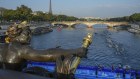 Tight race: Paris 2024 organisers want to hold a first-ever opening ceremony outside an Olympic stadium – by floating athletes down the Seine River on boats –  but that increases concerns about security.