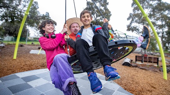 Swing artist Ian Pidd with Emily and Oscar practice at a park for the installation of Swing.