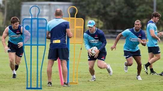 Waratahs players going about their business at training. 
