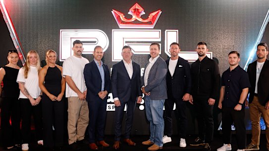 Professional Fighters League CEO Peter Murray, middle, with fighters Chelsea Hackett, Sara Collins, Jacinta Austin, Rob Wilkinson, Joseph Luciano, Sean Gucci and Raihere Dudes, Stan managing director Dan Taylor, director of Stan Sport Ben Kimber, and managing director of PFL James Frewin at the PFL Pacific launch in Sydney on Tuesday.