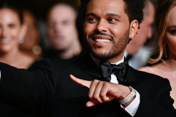 Canadian singer The Weeknd with his diamond-encrusted “ladies’” Piaget watch at Cannes.