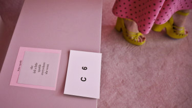 A tribute card to the late fashion designer Kate Spade is placed on seats for arriving guest the collection show during New York Fashion Week.