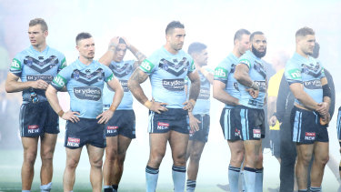 The Blues look dejected after defeat in game three of the 2018 Origin series.