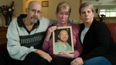 Joy and Mike Van Duinen, with their daughter, Tracey Filocamo, holding a photo of Gary Van Duinen who took his own life after a 13-hour gambling binge. 