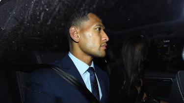 Awaiting his fare: Israel Folau leaves a Sydney law firm on Tuesday.