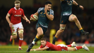 Wallabies centre Hunter Paisami skips past the tackle of Wales player Liam Williams last month.