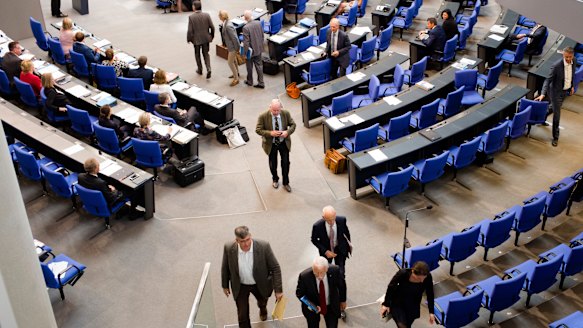 MPs of the Alternative for Germany and faction leader Alexander Gauland, centre, walk out.