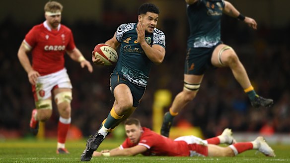 Wallabies centre Hunter Paisami skips past the tackle of Wales player Liam Williams last month.