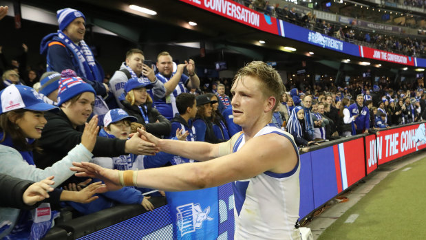 Roo beauty: North Melbourne match-winner Jack Ziebell celebrates with fans at Etihad Stadium.