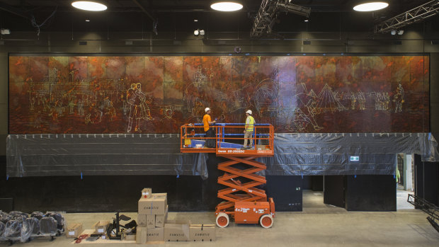 Staff from Abode Restoration and International Conservation Service install Sidney Nolan's <i>Eureka Stockade</i> in the Cultural Centre in ANU's new Kambri precinct. 