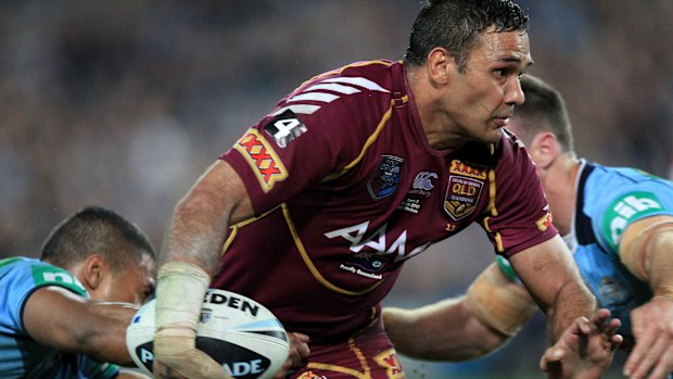 Justin Hodges tries to break free.