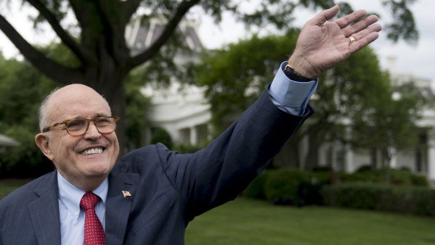Rudy Giuliani, a lawyer for President Donald Trump, waves to people at the White House.