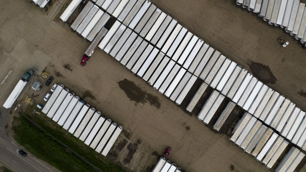 Semi-truck trailers in the parking lot of the JBS Beef Production Facility in Greeley, Colorado. 