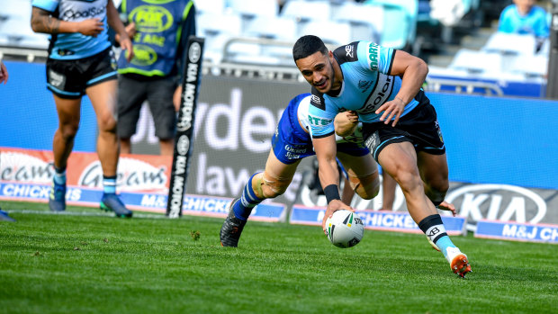 Hot to trot: Valentine Holmes scores a try to go with the three he set up on Sunday. 