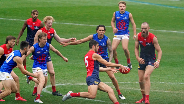 Kicking on: The Demons played an intraclub match at the MCG on Sunday after their round 3 fixture against the Bombers was postponed.
