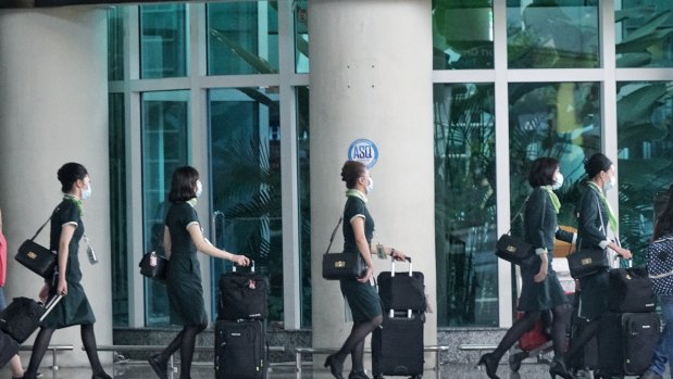 Flight crew arrive at Denpasar airport in Bali earlier this week.