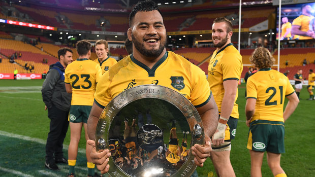 Good times: Tupou holds the Mandela Plate after the Wallabies' win against the Springboks in Brisbane this year. 