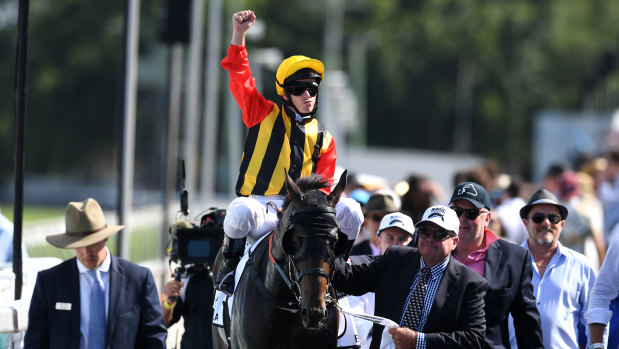 Salute: Tim Clark celebrates after winning the Magic Millions Guineas with Boomsara after a thrilling finish.